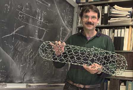 Alex Zettl with a model of a carbon nanotube